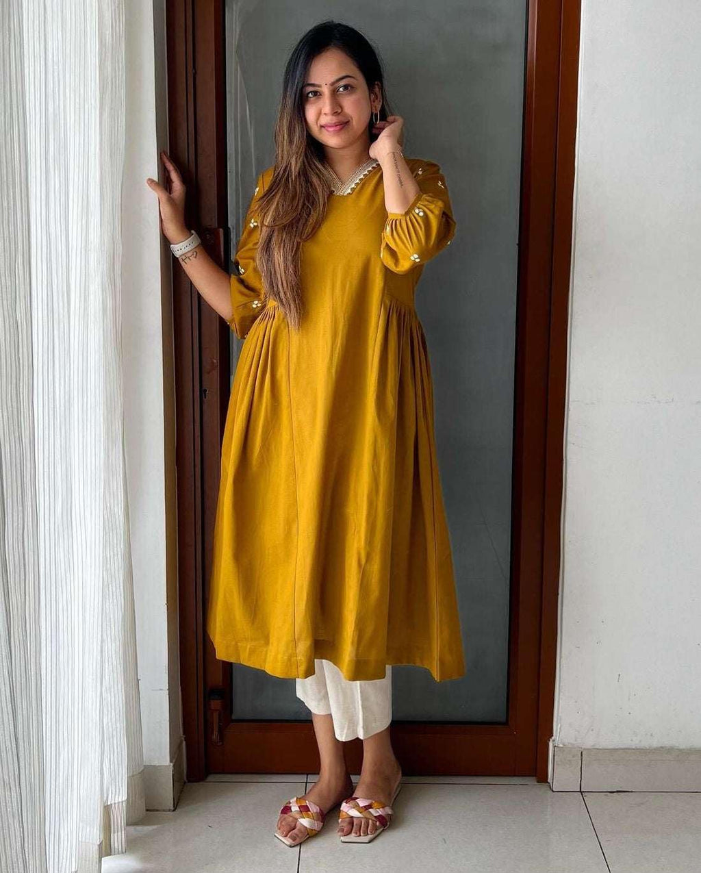 Mustard Yellow Flared Kurta with White Pants – Casual Ethnic Wear for Women
(BLACKLUXE CRAFTS) - BLACKLUXECRAFTS