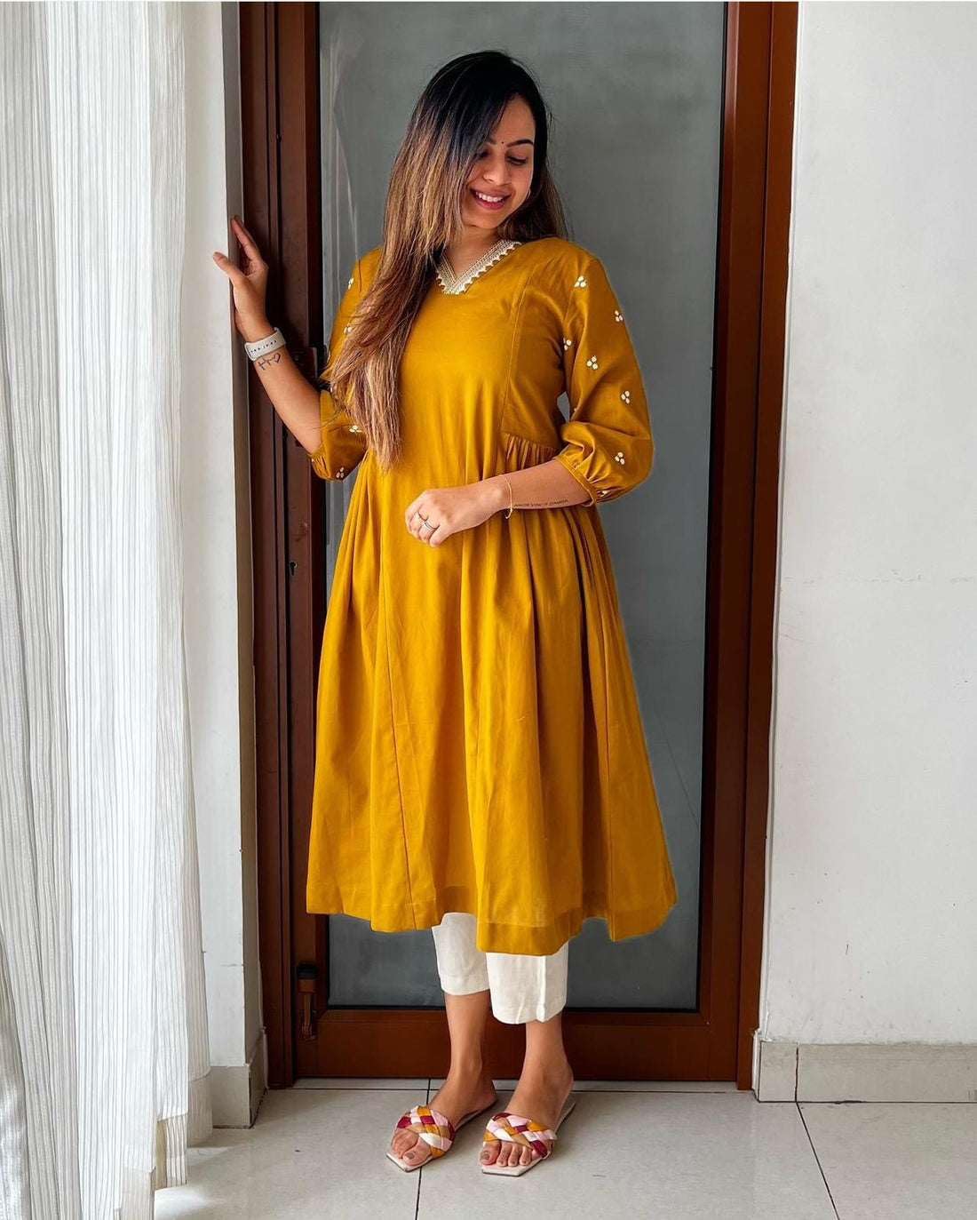 Mustard Yellow Flared Kurta with White Pants – Casual Ethnic Wear for Women
(BLACKLUXE CRAFTS) - BLACKLUXECRAFTS